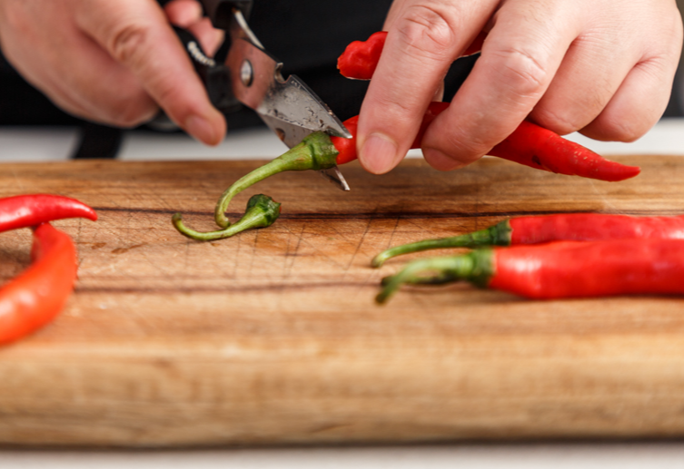 Wash, dry, chop chili peppers; wear gloves to avoid irritation.