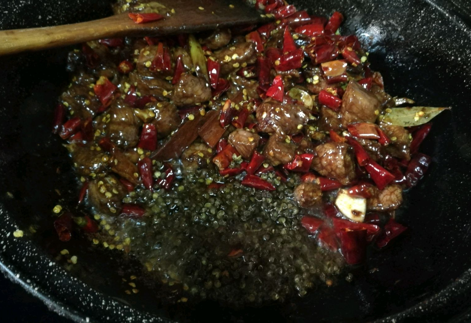 Stir-fry meat and chili peppers, add Sichuan peppercorns for a burst of flavor.