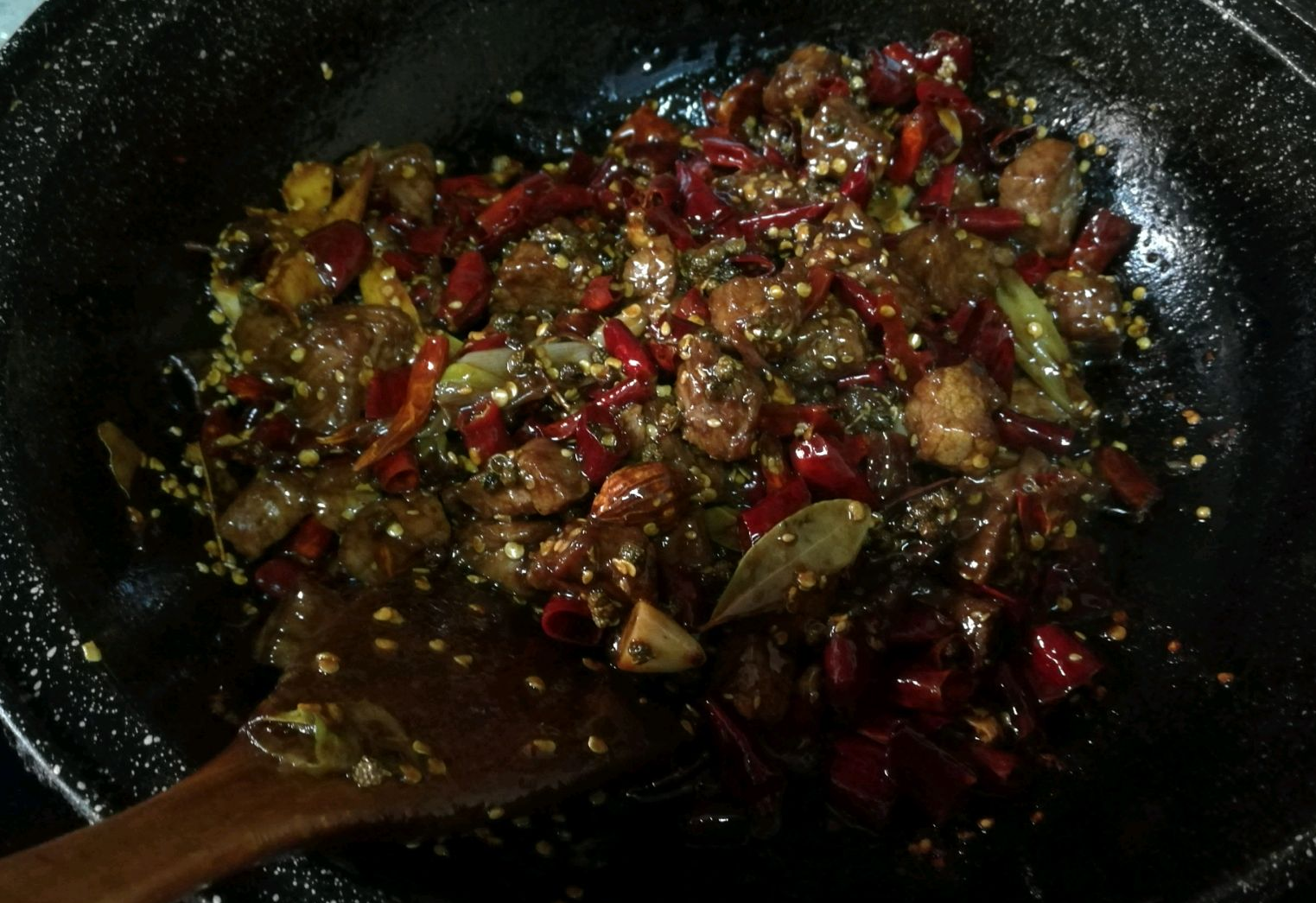 Add sesame seeds, stir-fry, let beef sit to absorb flavors.