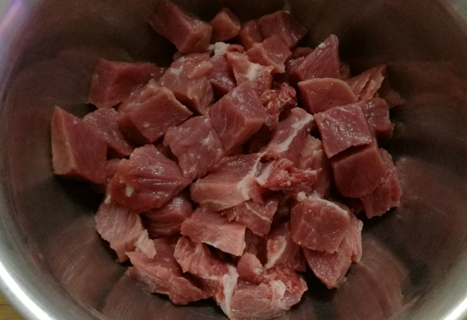 Cut beef into uniform cubes for better flavor absorption and texture; sharpen knife skills.