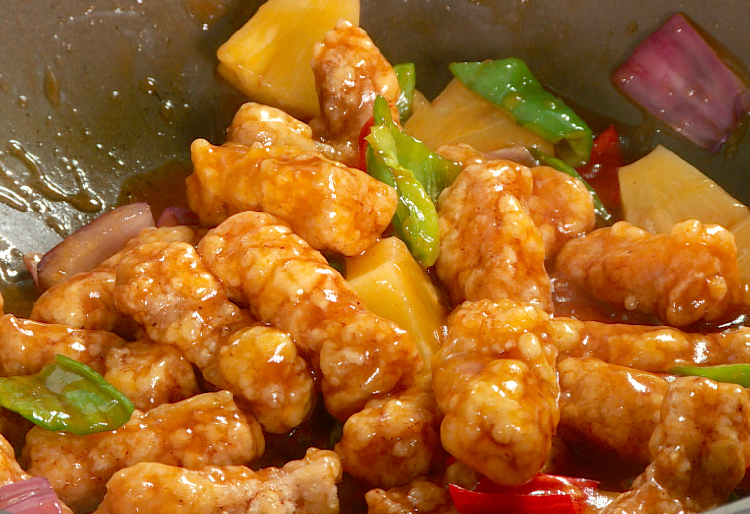 Serve homemade sweet and sour pork tenderloin on plate.