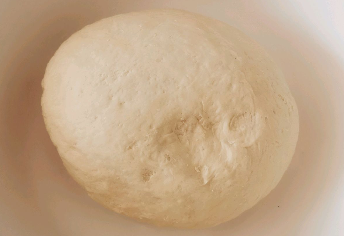 Mix flour and yeast, knead with warm water until soft. Let dough rest and rise for 10-30 minutes for softer texture.