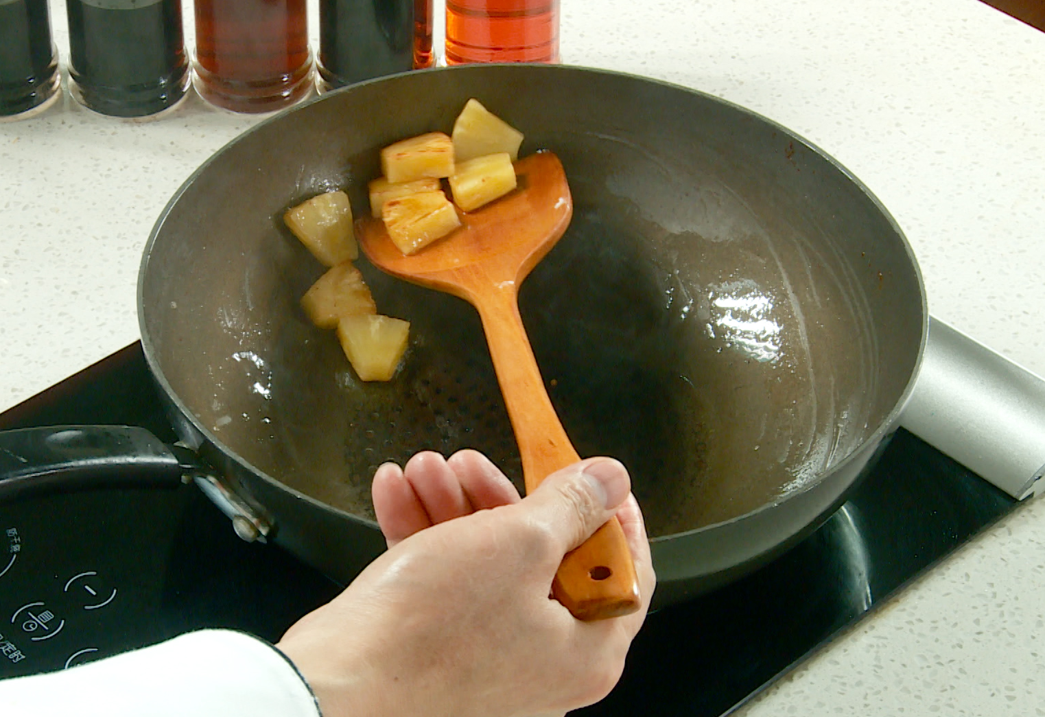 Cook pineapple chunks in oil until cooked through. Set aside.