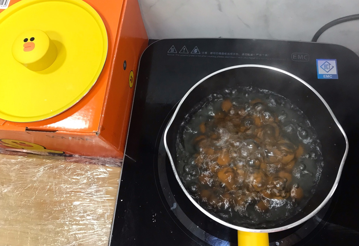 Boil tapioca pearls until they float, then remove.