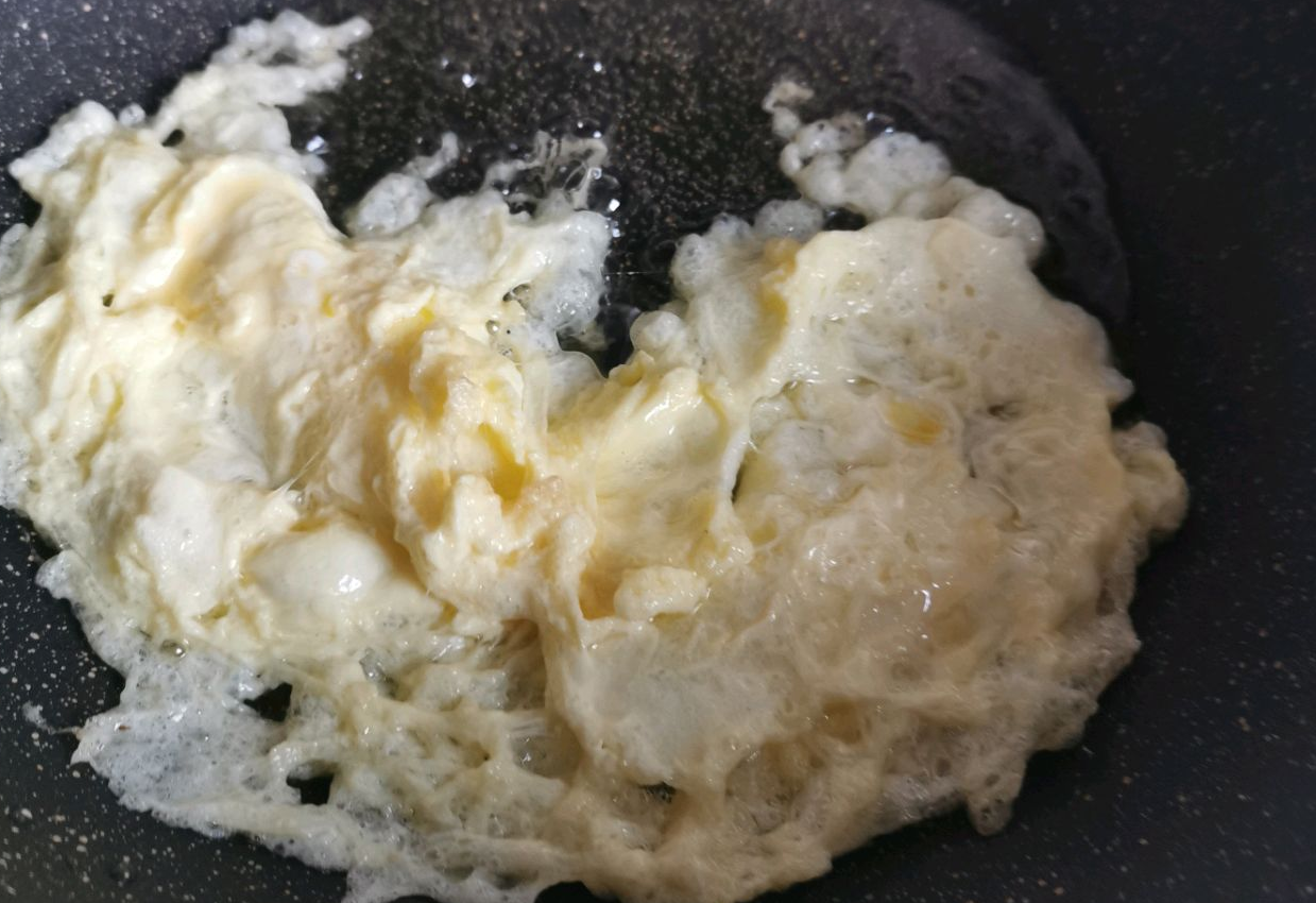 Pan-fry beaten egg until cooked.