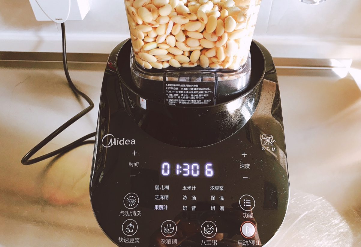 Blend soaked soybeans with water in a food processor on vegetable or juice setting.