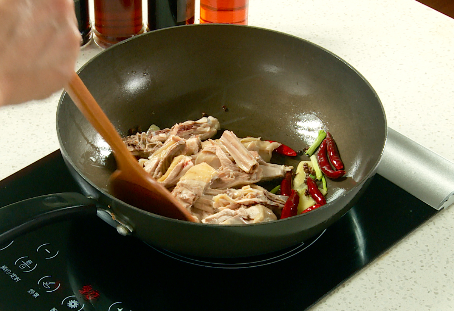 Season chicken with wine, soy sauce, and vinegar; stir-fry for a flavorful dish.