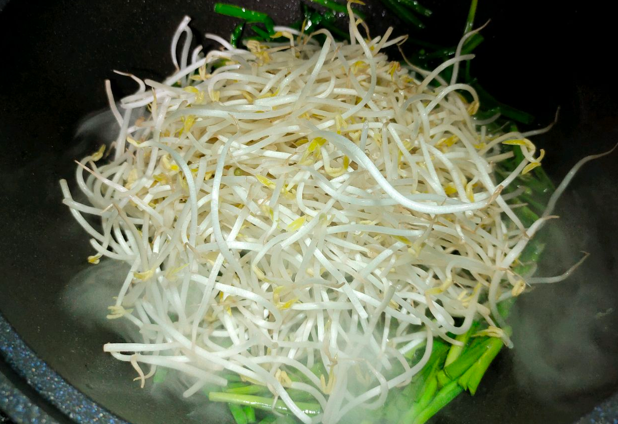 Stir-fry mung bean sprouts on high heat to maintain crisp texture.