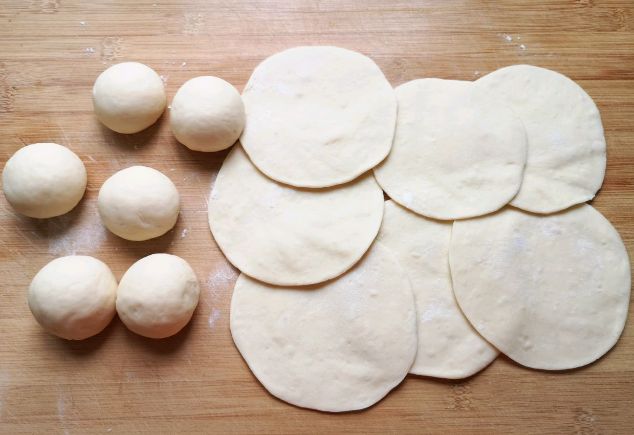 Instructions for shaping and rolling dough into bun wrappers.