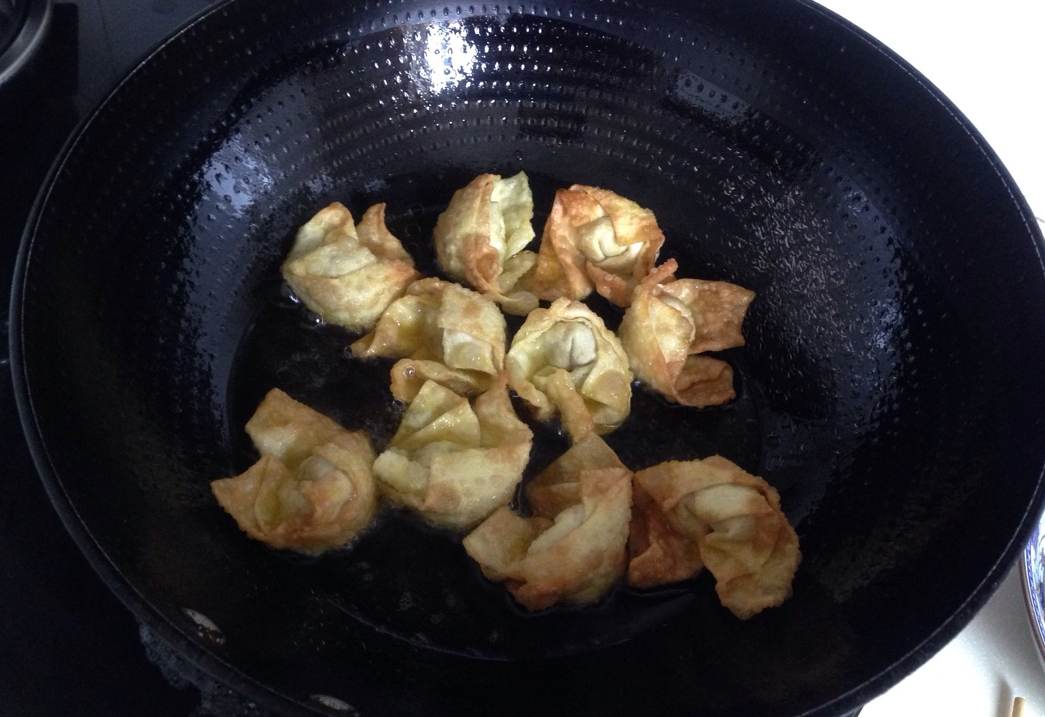 Heat oil, add wontons once 70-80% hot, fry for 4 mins. Ensure oil temp is right for crispy shell and cooked inside.