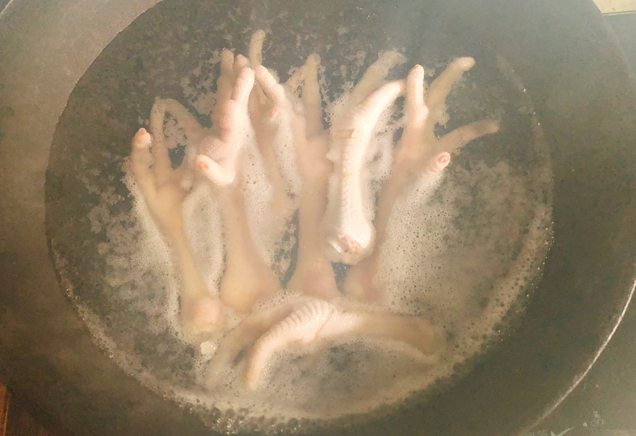 Boil chicken feet in cold water to remove blood and reduce odor. Skim off foam for better flavor.