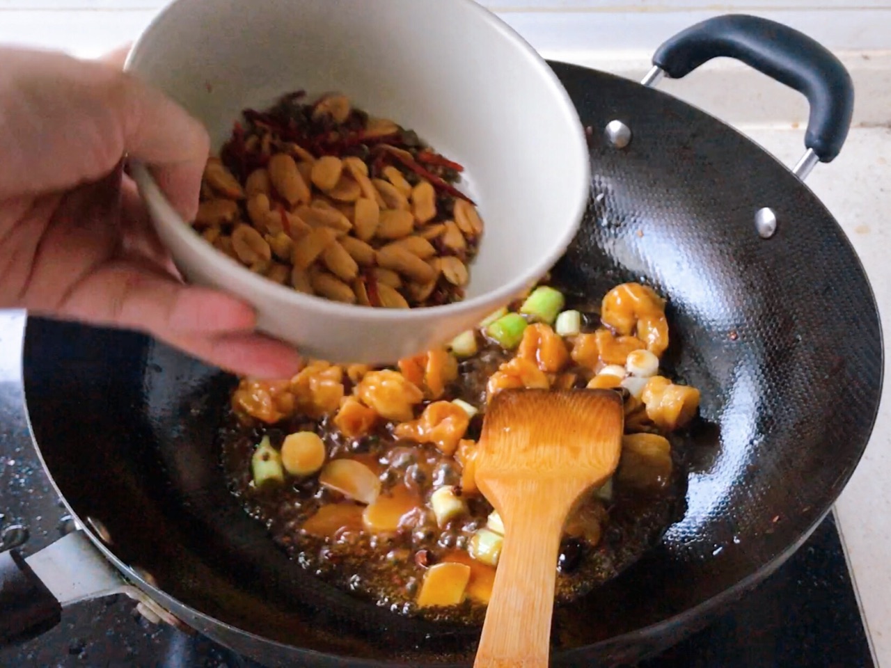 Add peanuts, stir-fry until combined. Tips for handling peanuts in Kung Pao Shrimp: roast slowly for color and crispiness.