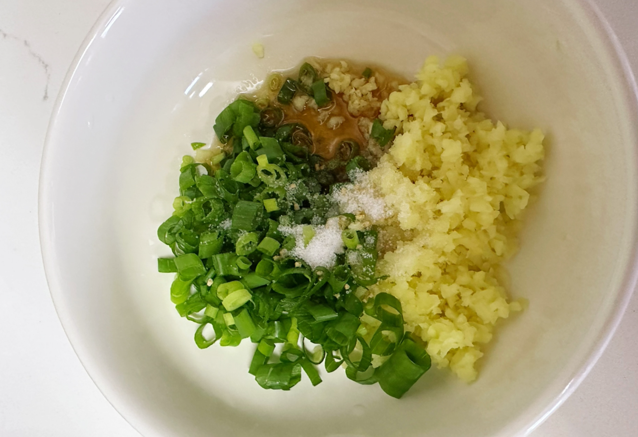 Recipe: Combine chopped scallions, ginger, sesame oil, sugar, salt, and chicken bouillon.