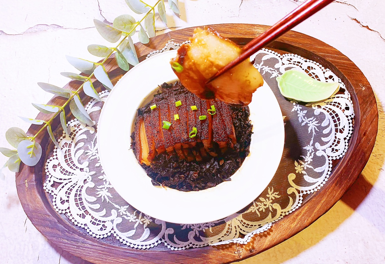 Serve steamed dish inverted on plate, garnished with chopped scallions.