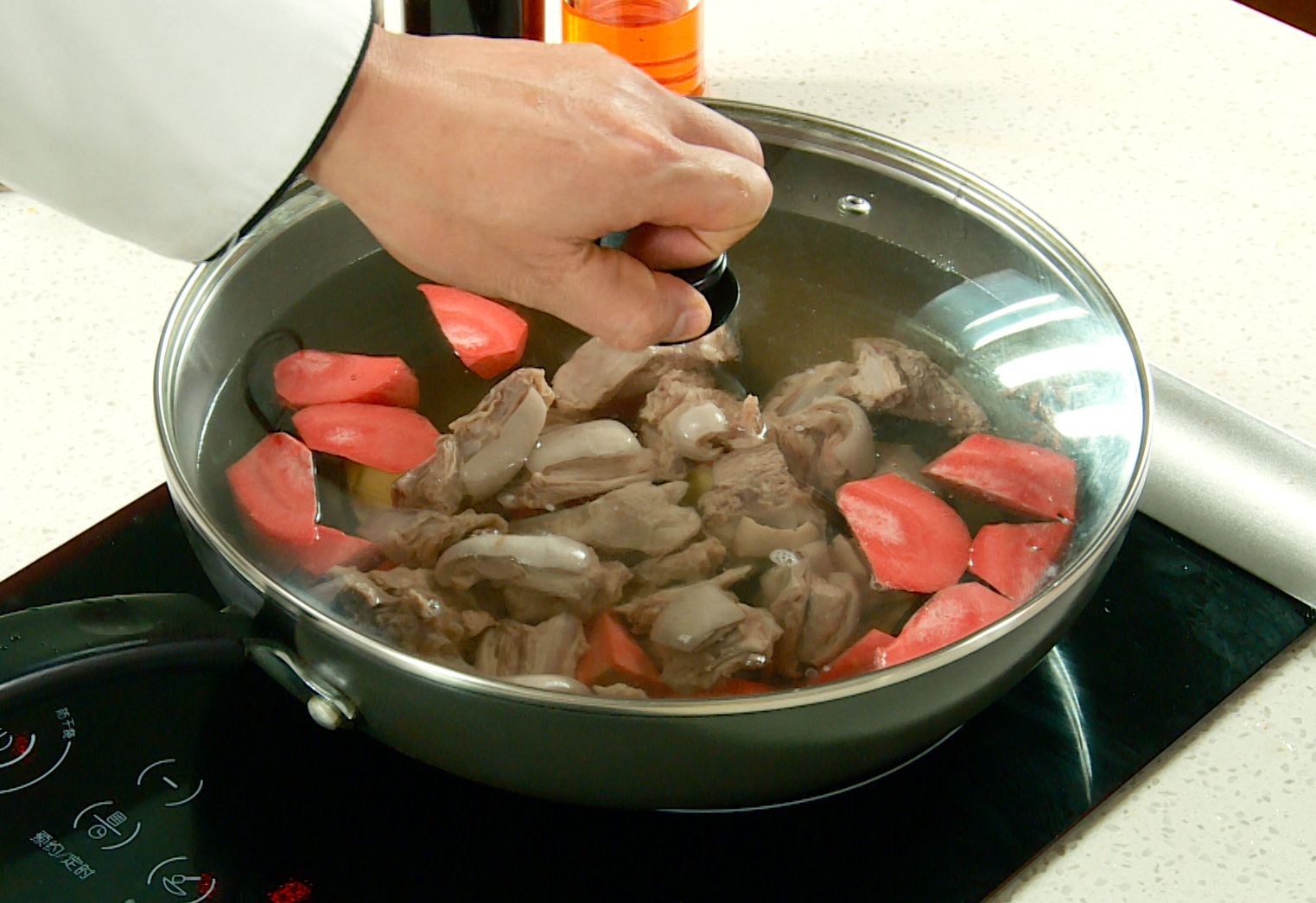 Cook lamb ribs: Add water, cooking wine, carrot, ginger, and star anise. Boil.