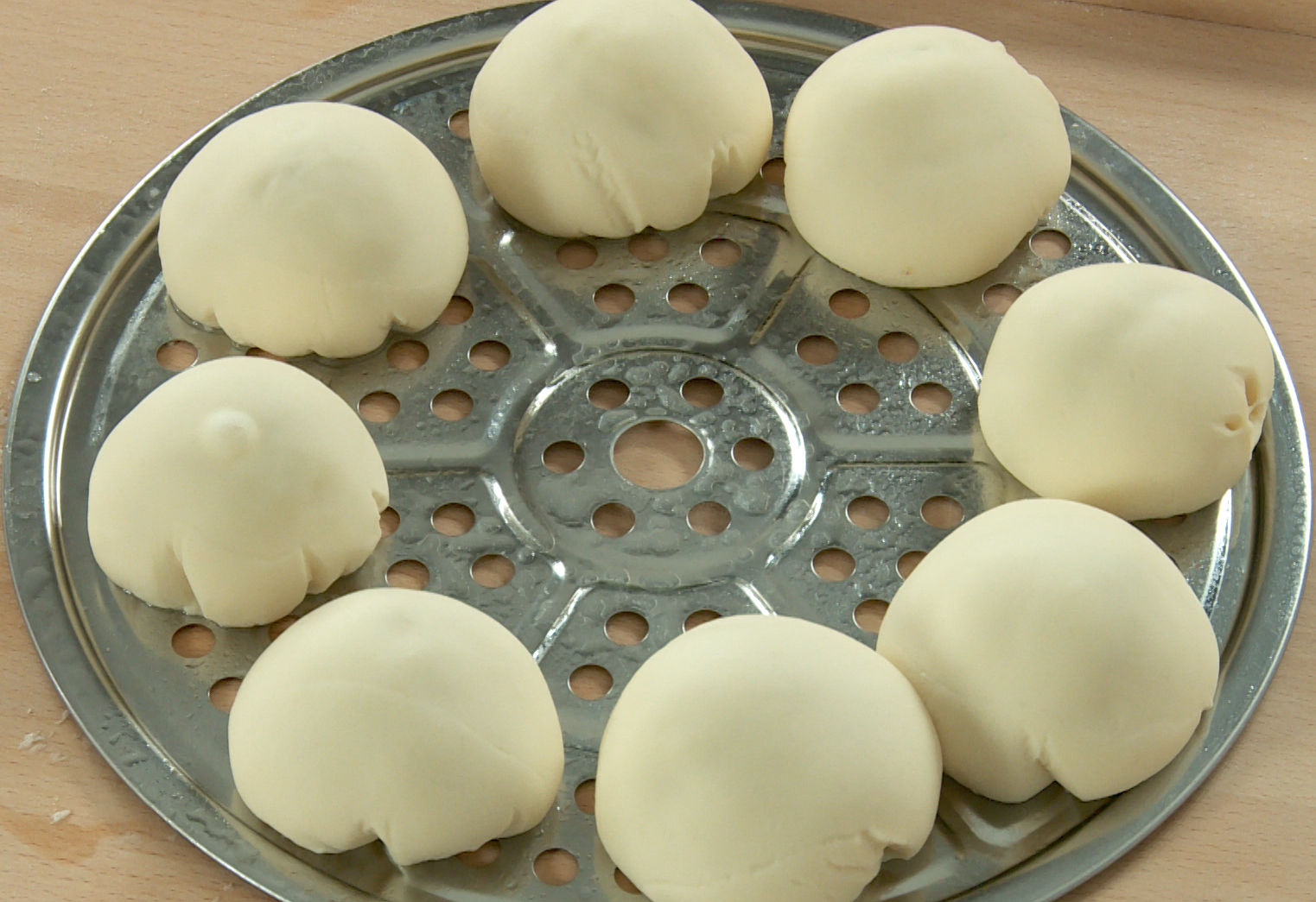 Arrange and proof red bean buns on a tray in warm environment for 2 hours.