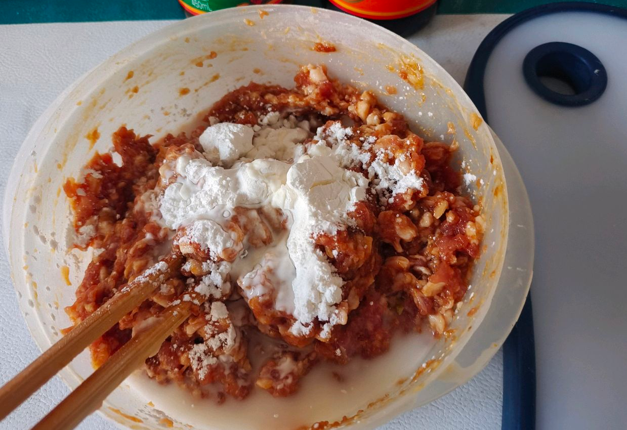 Season ground meat with wine, soy sauce, salt, pepper, and cornstarch for firm texture.