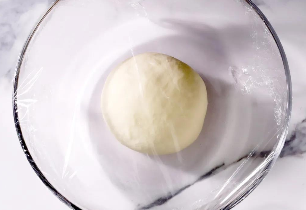 Cover dough, let rest for 20-30 mins for fermentation. After, dough becomes fluffy, soft, and tastier.