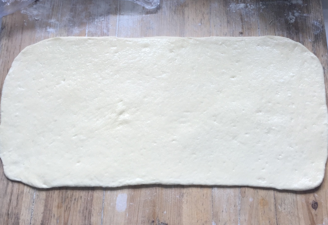 Roll half of the dough into a rectangle.