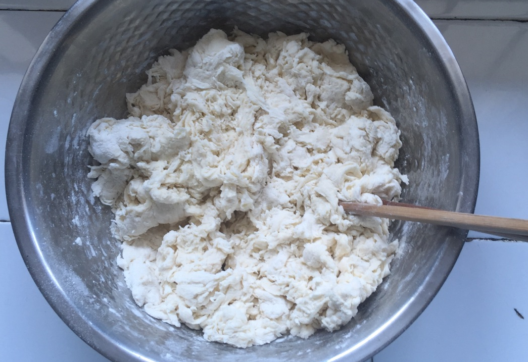 Add yeast mixture to flour, kneading until dough is flaky.