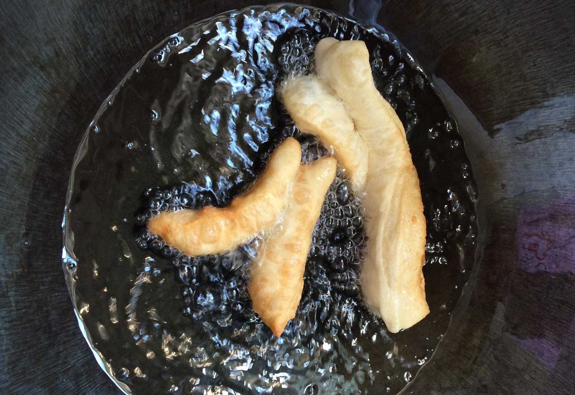 Fry prepared dough strips in hot oil over medium to low heat.