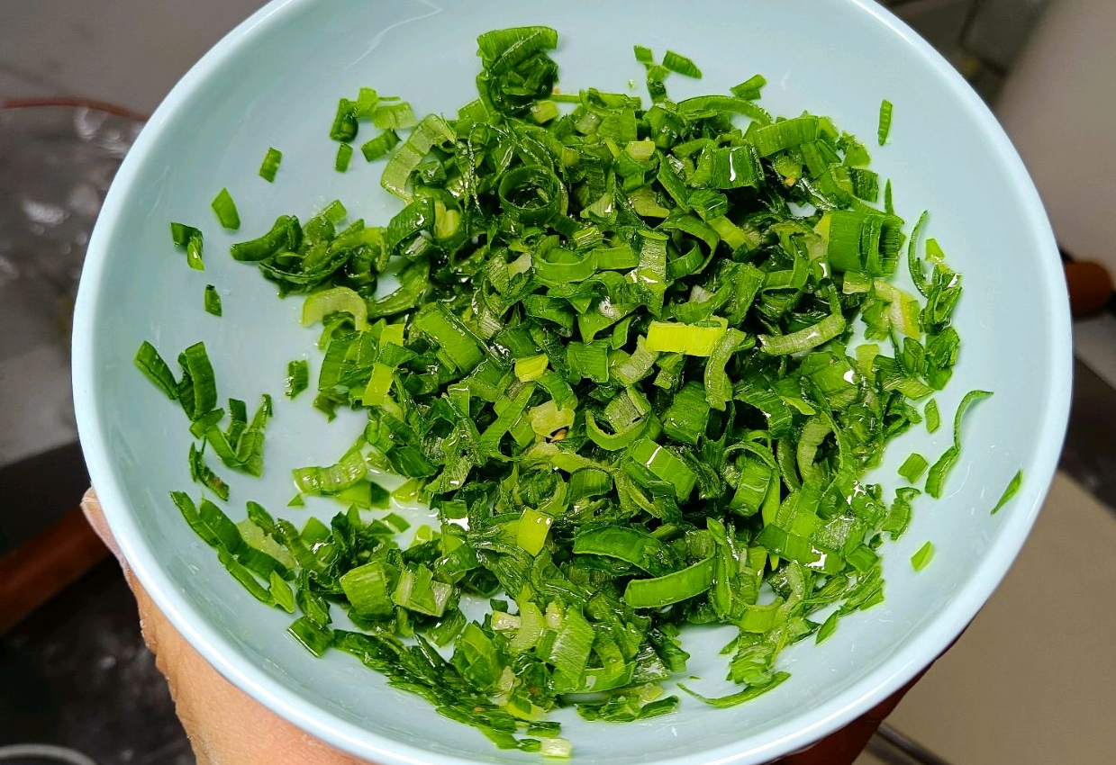 Ferment dough, wash, finely chop and mix scallions with salt & oil.