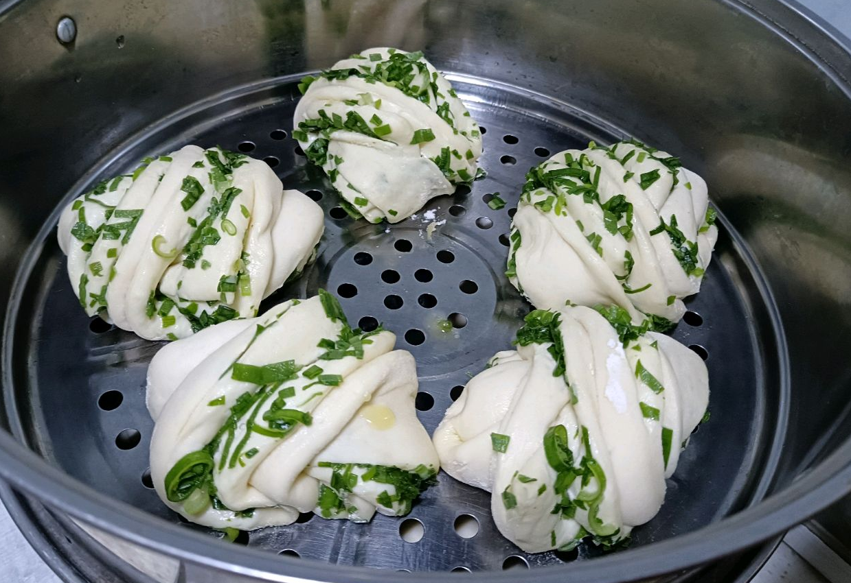 Shape Scallion Rolls, let them ferment for 10 mins in a steamer for fluffy texture.