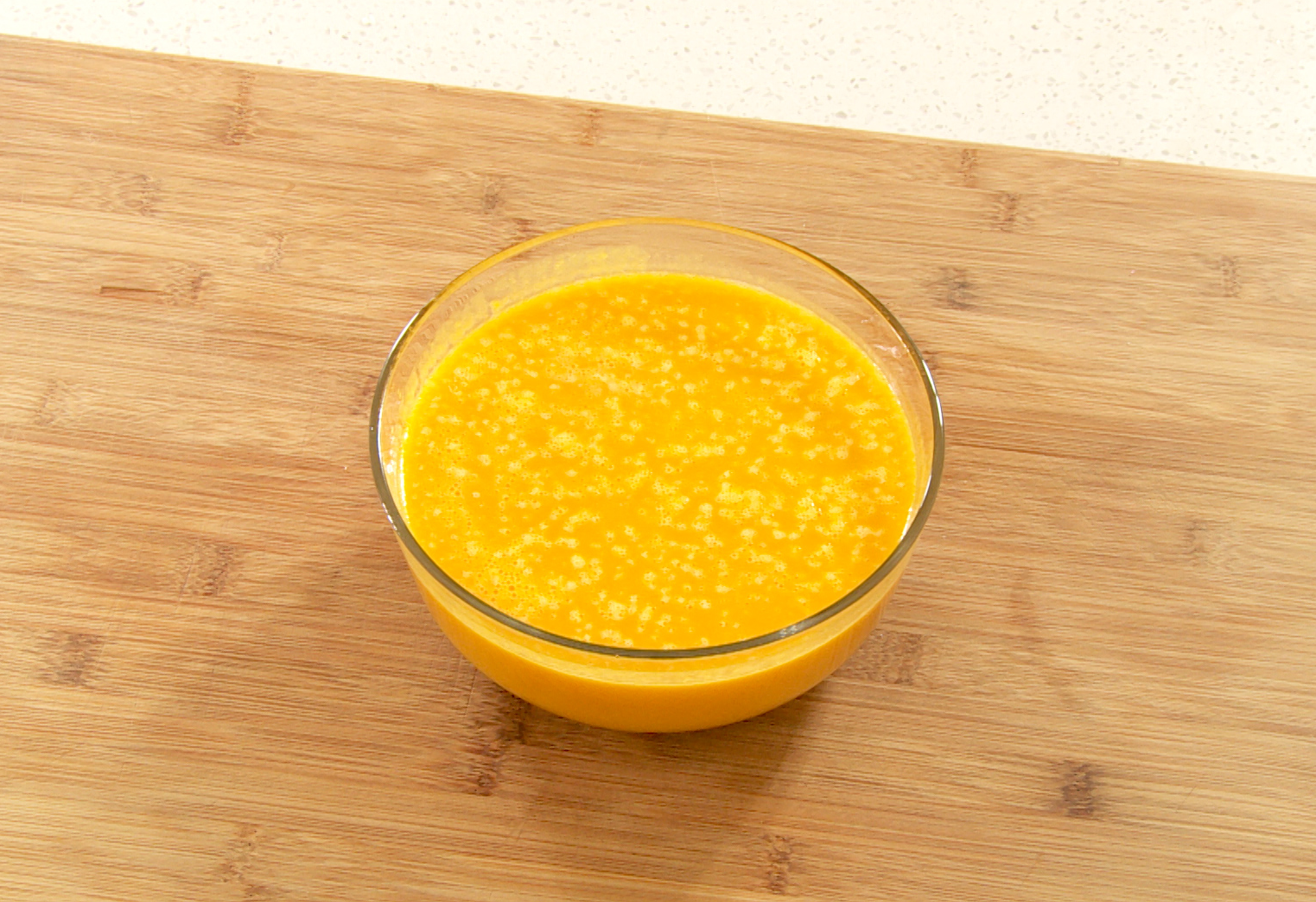 Blend steamed pumpkin, broth, and toast for smooth soup.