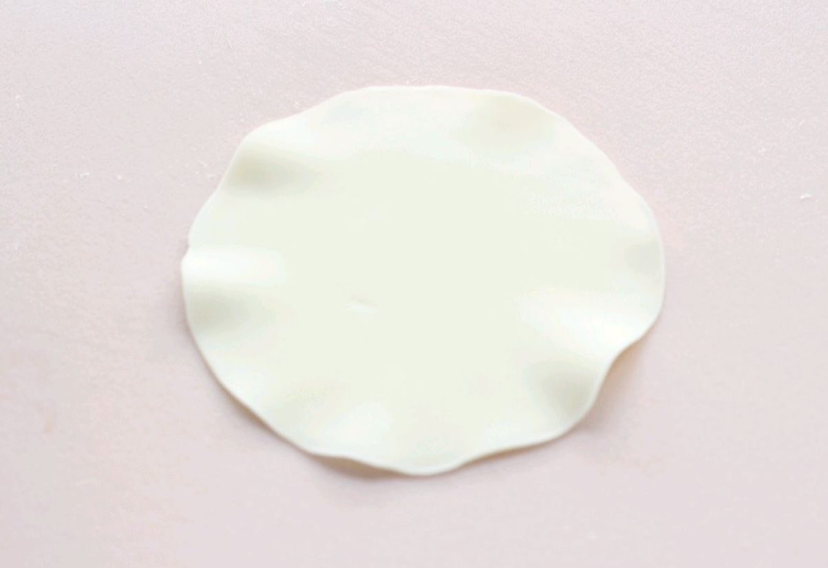 Roll out dumpling wrapper thinly, thicker center, thinner edges. Buy wrappers from store.