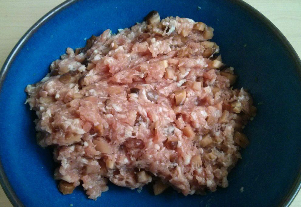 Prepare filling with soy sauce, salt, sesame oil, and mushroom water for pork and mushroom dumplings.