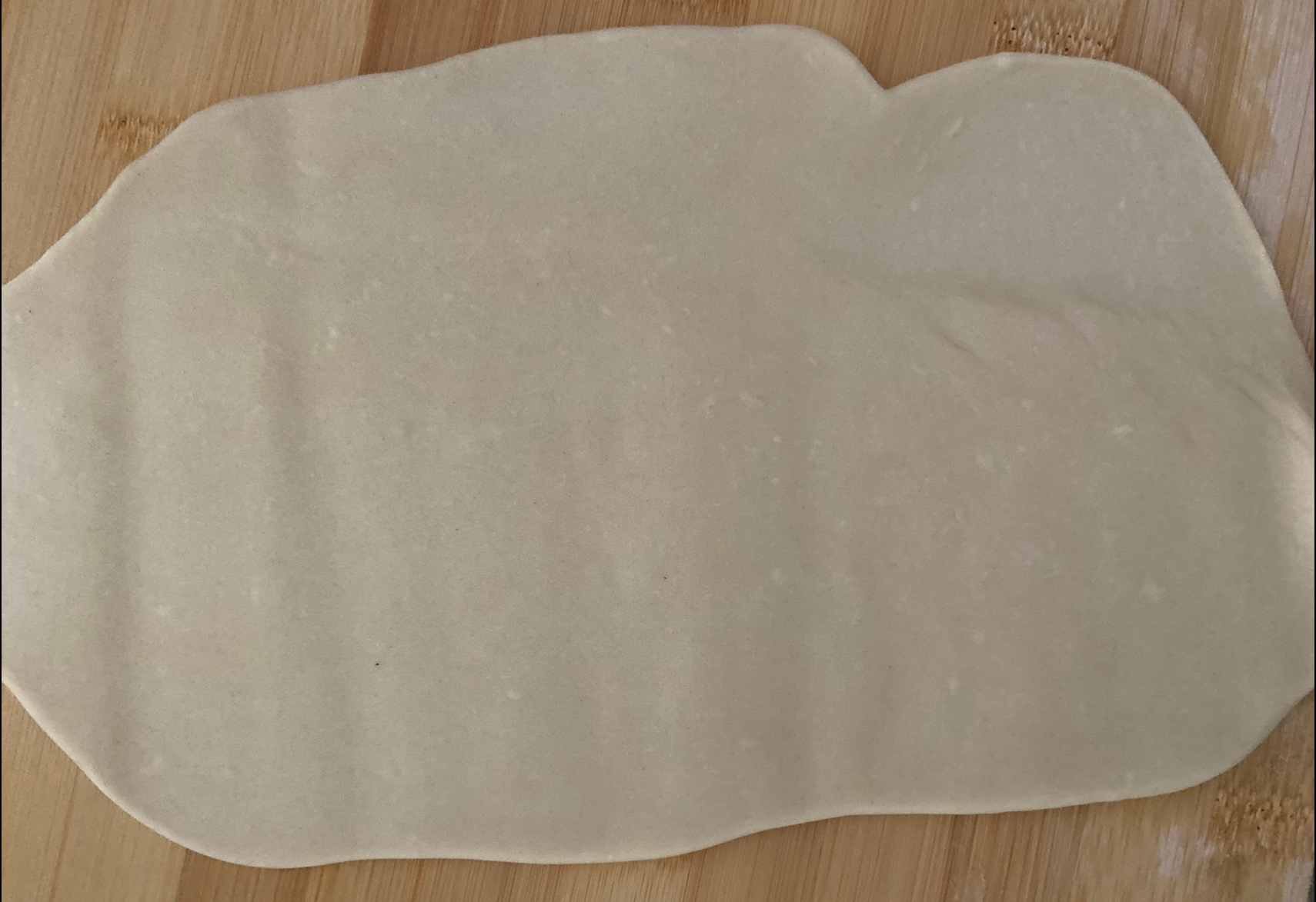 Roll out one portion of dough into a rectangle shape.