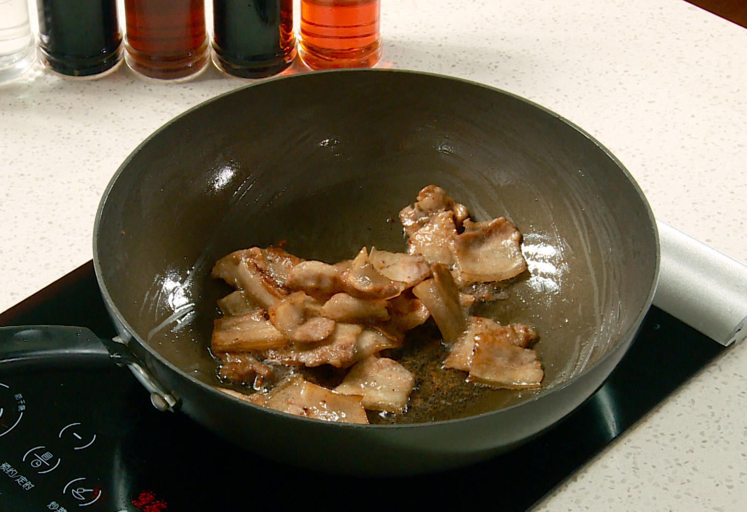 Season pork with dark soy sauce, stir-fry until evenly coated and absorbed. Set aside.