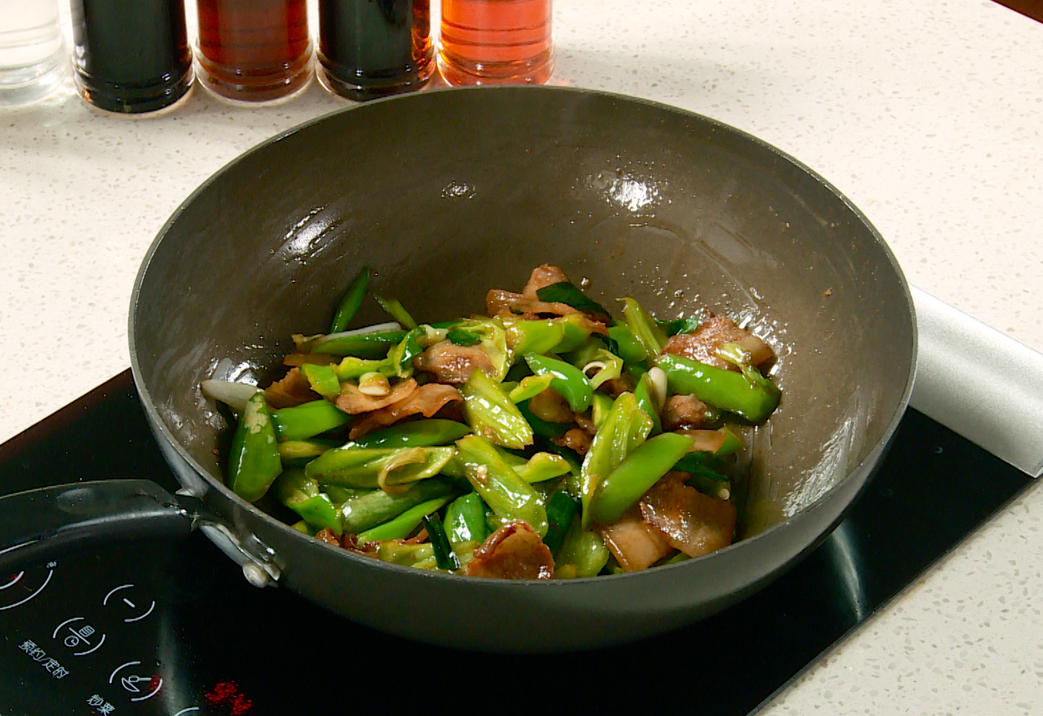 Season pork and vegetables with soy sauce; cook until heated through.