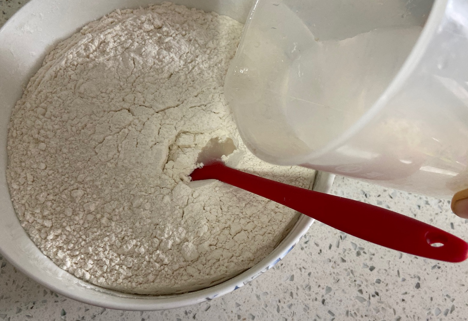 Mix flour, salt, and water to form lumps.