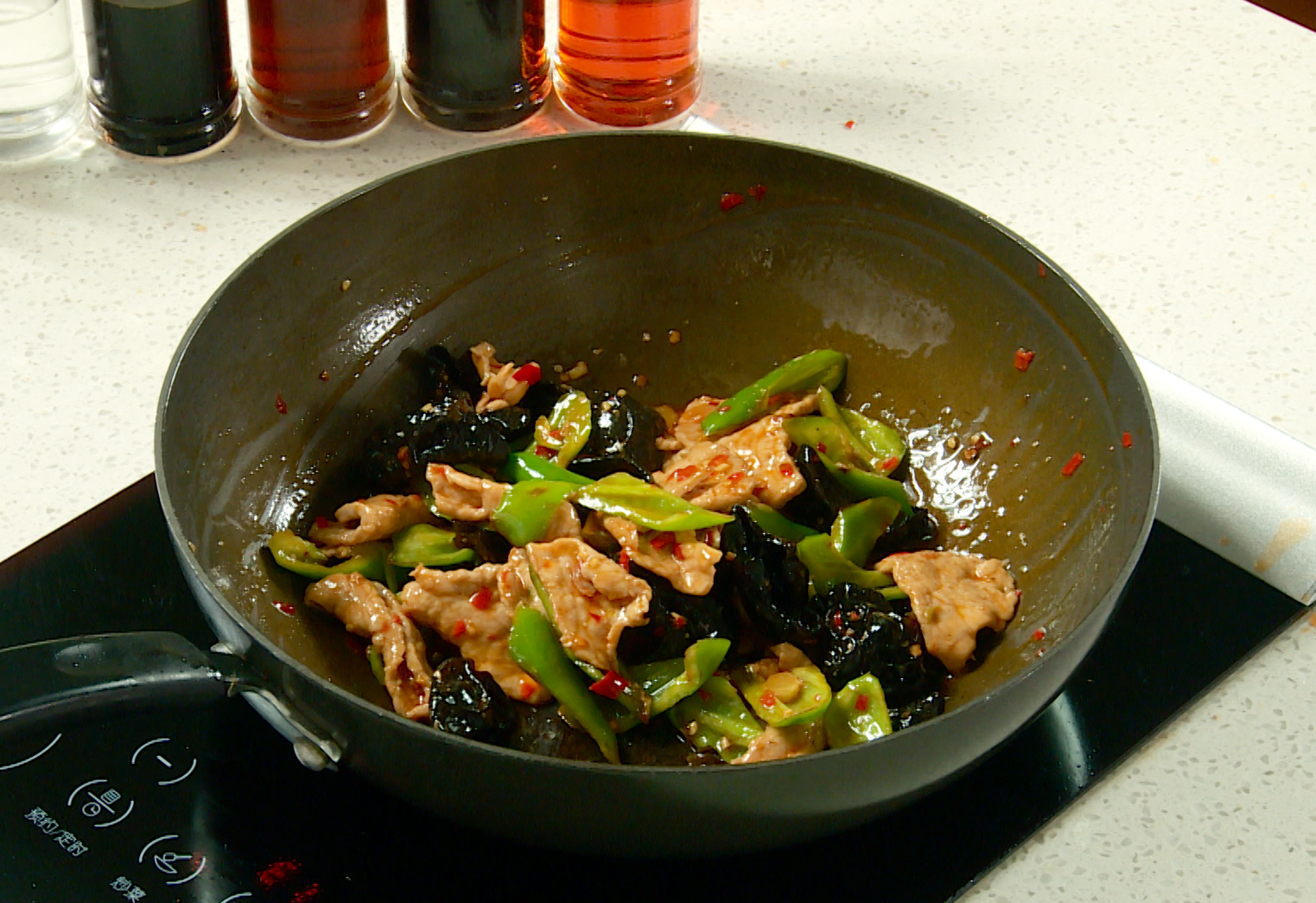 Combine roasted green peppers with other ingredients in pan; stir-fry until well mixed.