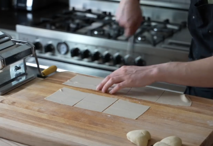 Roll out dough, cut into lengths, then use knife to make even squares.