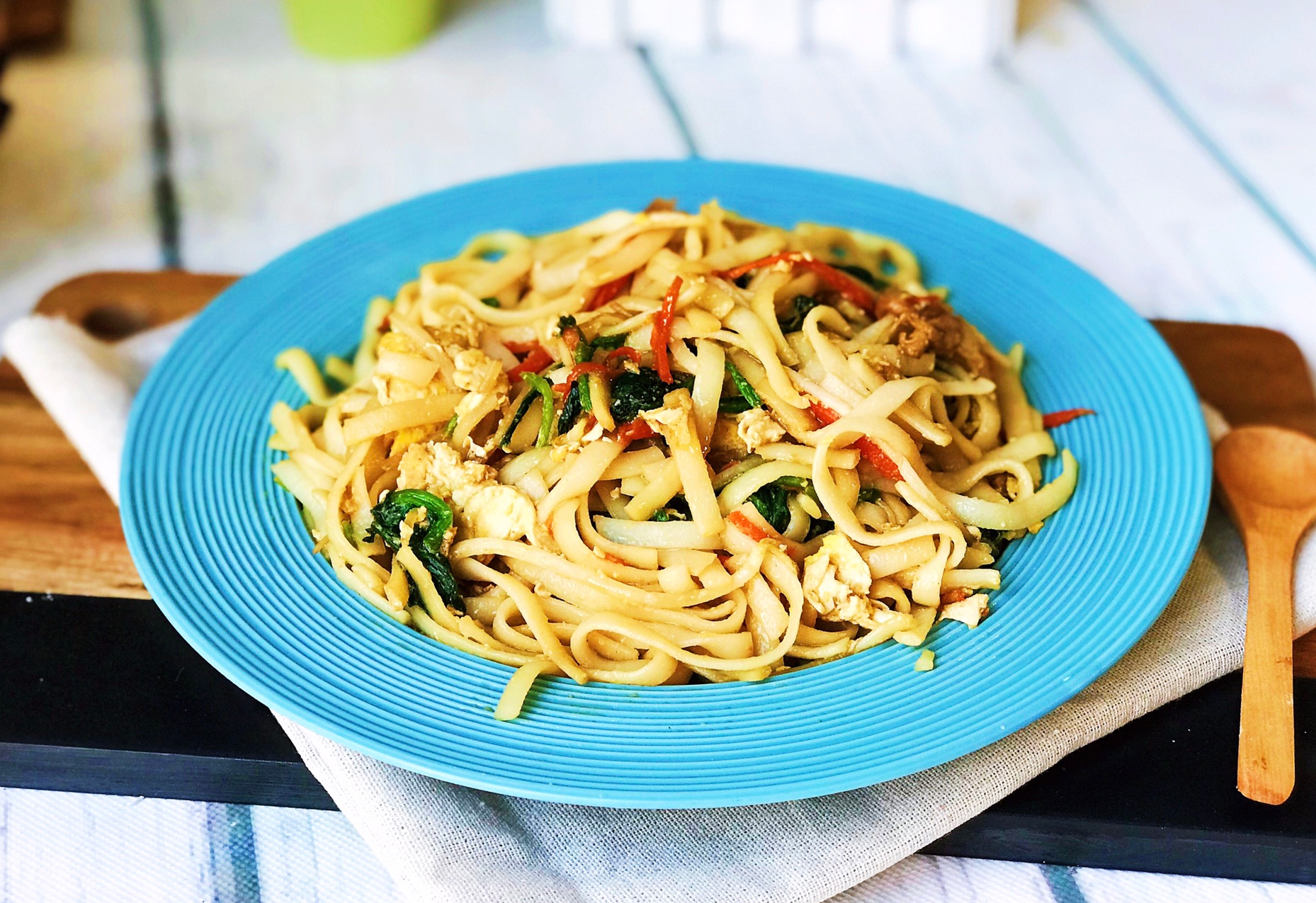 Serve Beef Chow Fun on a plate for a delicious meal.