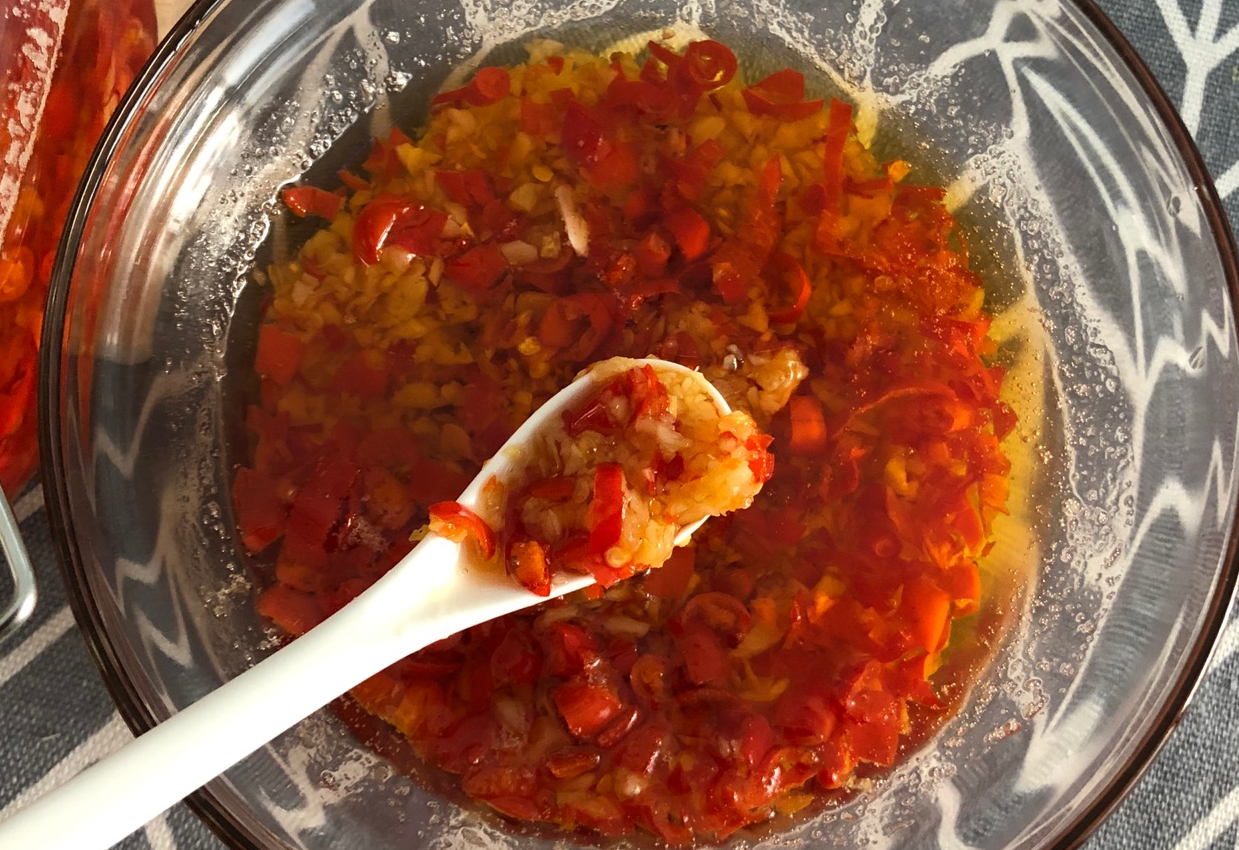 Garlic chili sauce ready with a strong chili aroma in the kitchen.