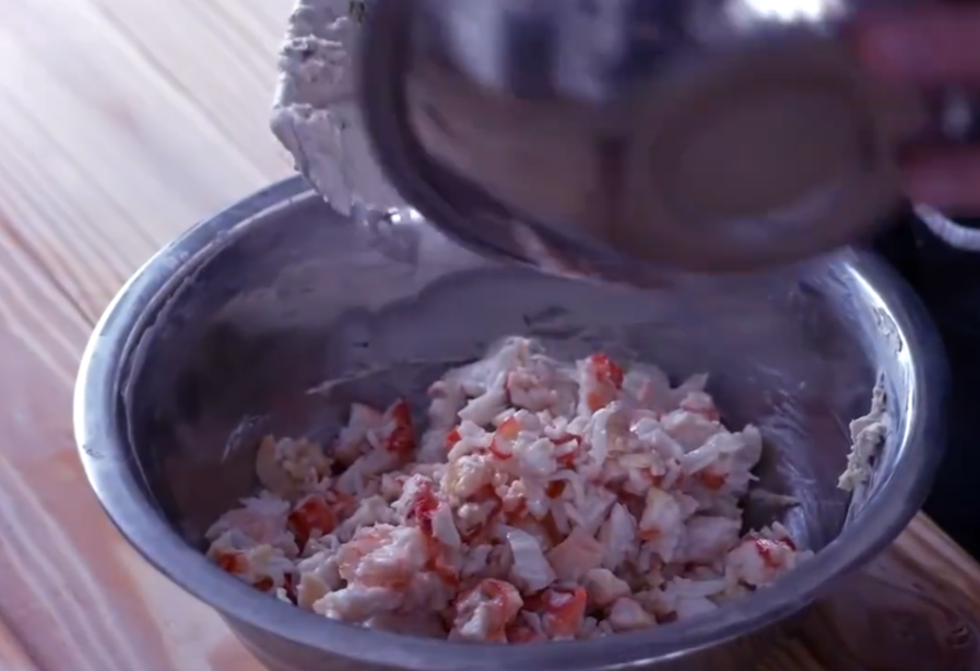 Combine prepared crab meat with mixture, stirring evenly.