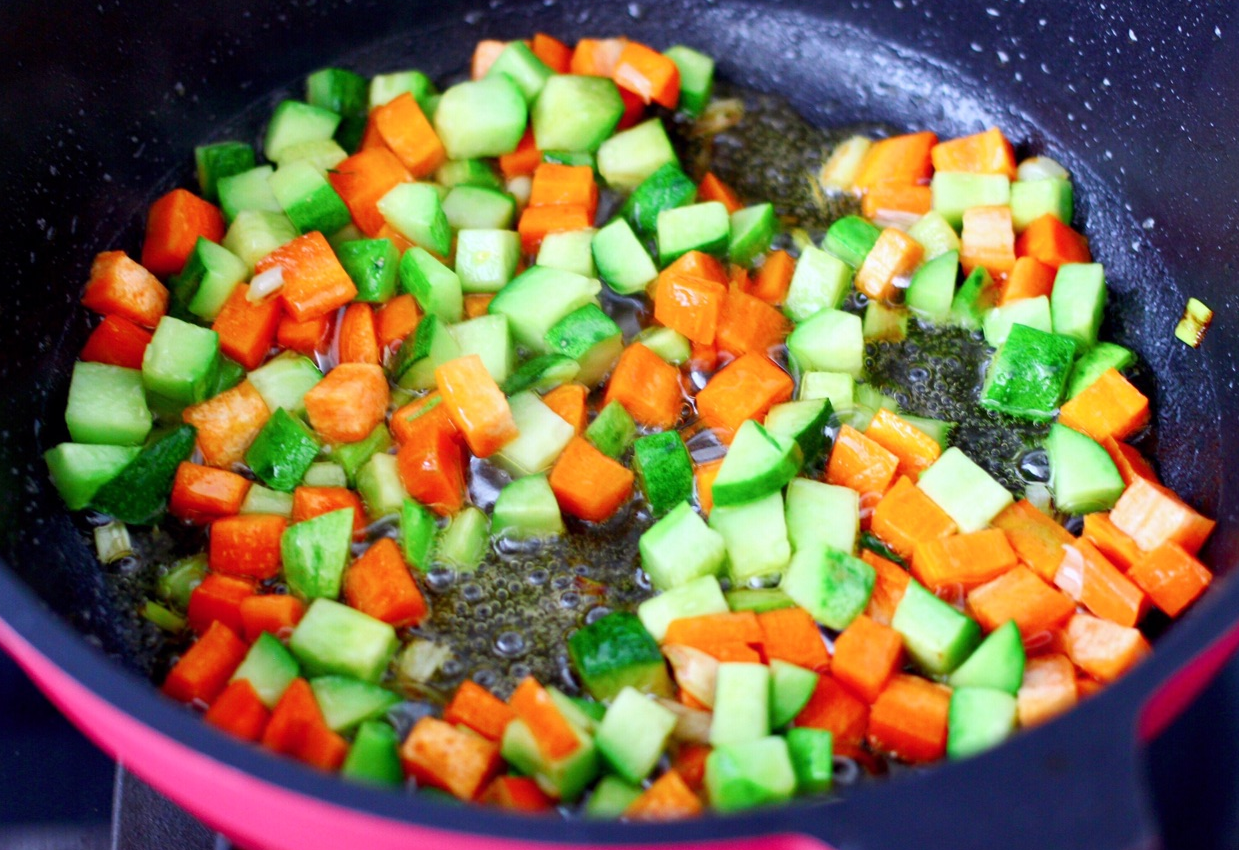 Stir-fry vegetables on high heat until cooked through.