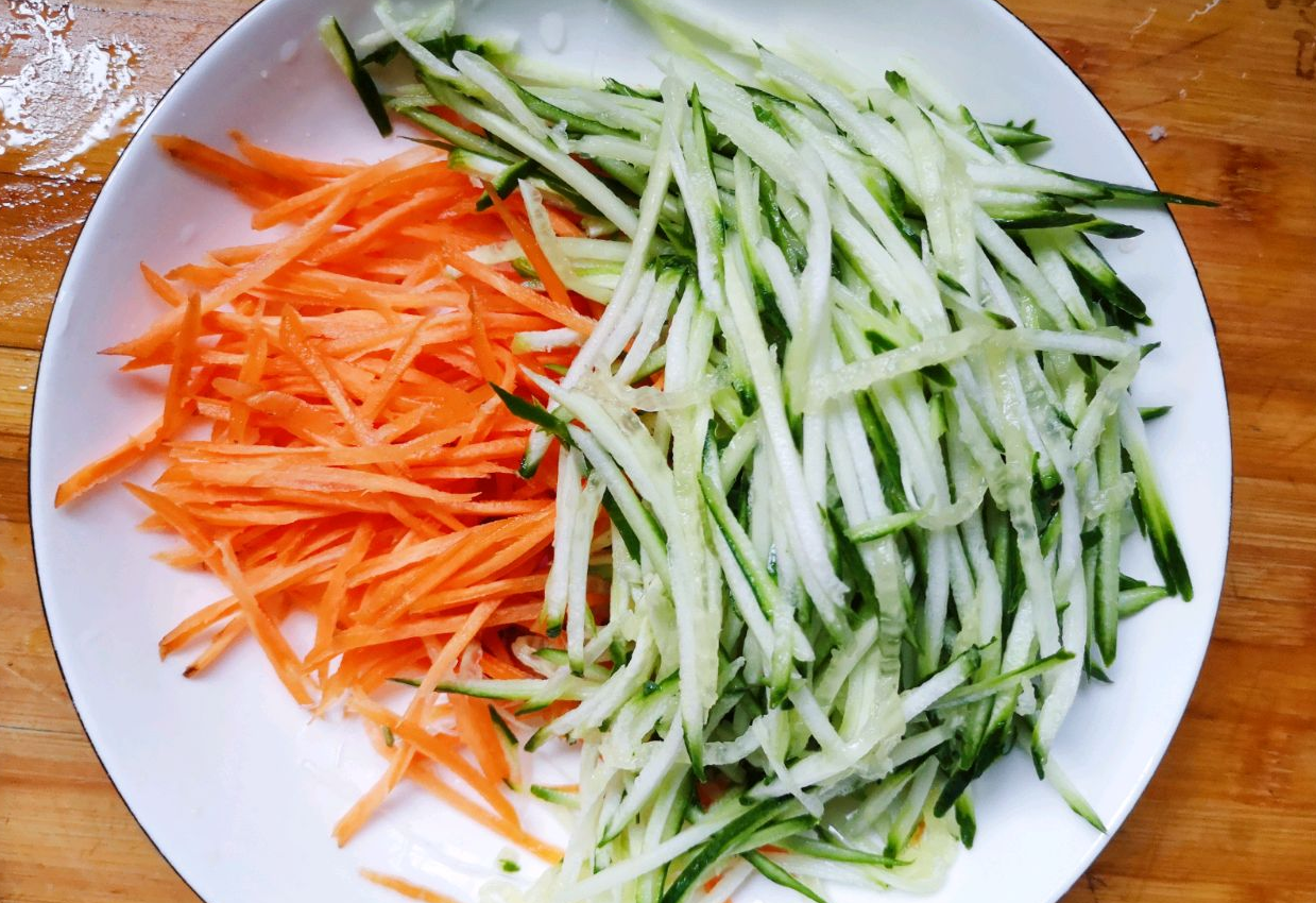 Shred carrot and cucumber, use knife if no shredder available.