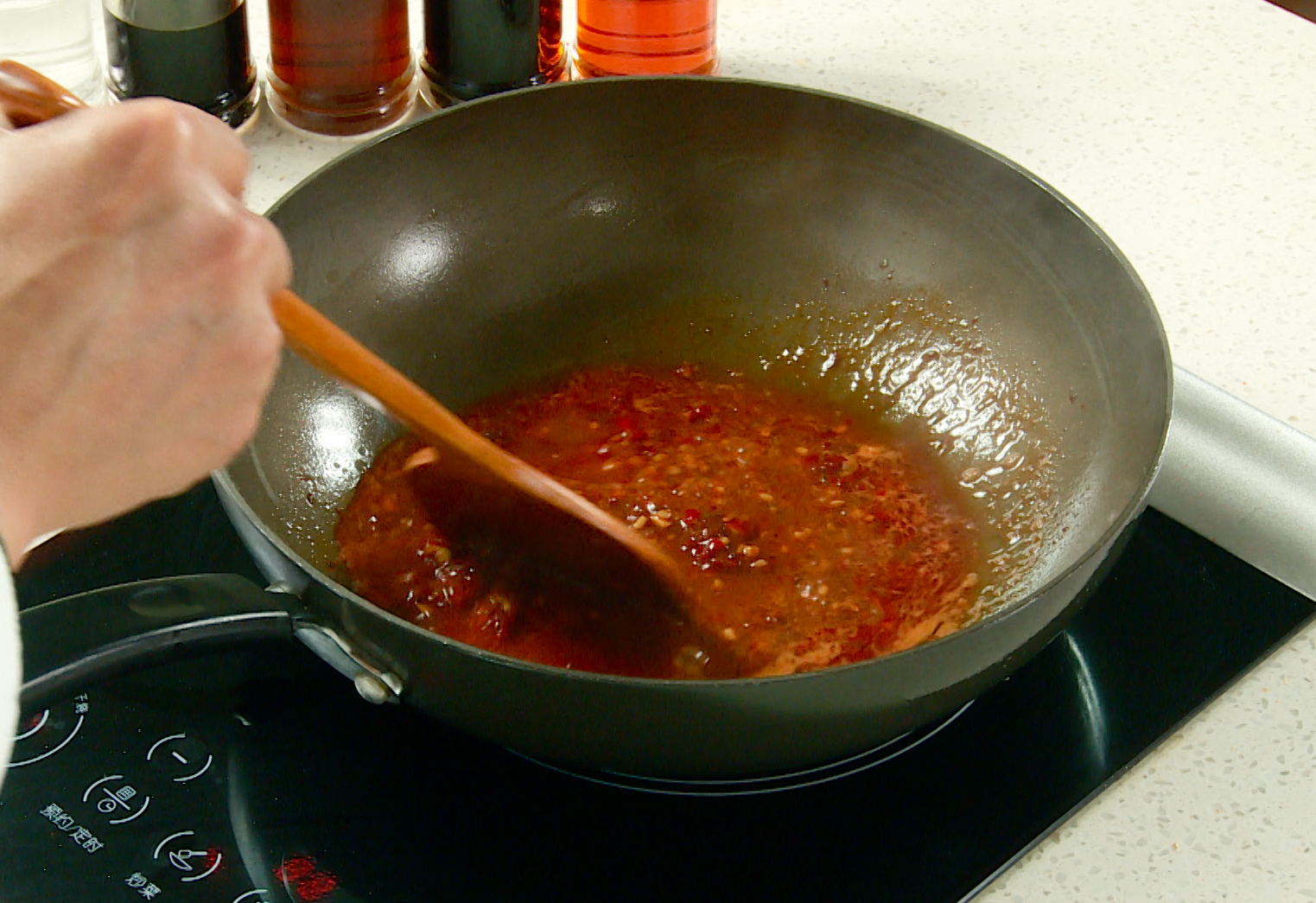 Instructions for preparing a flavorful sauce with ginger, doubanjiang, sweet bean paste, and water.