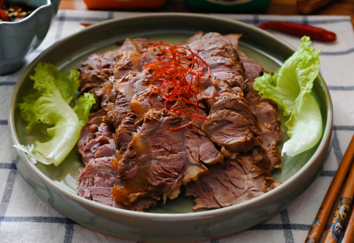 Cook beef shank until tender, slice, and serve.