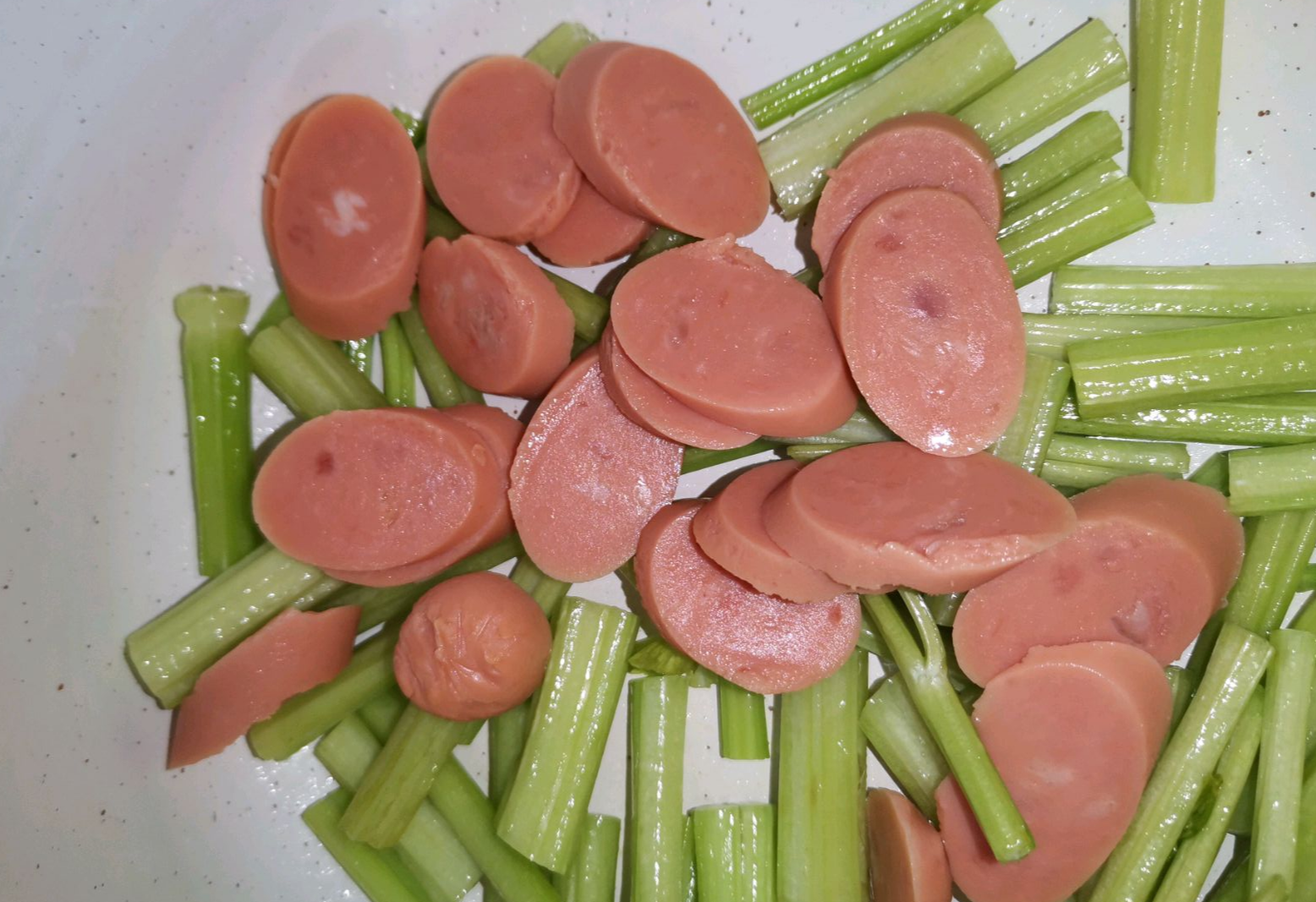 Instructions: Stir-fry sausage for 1 min. Tip: Cook meat before adding vegetables.