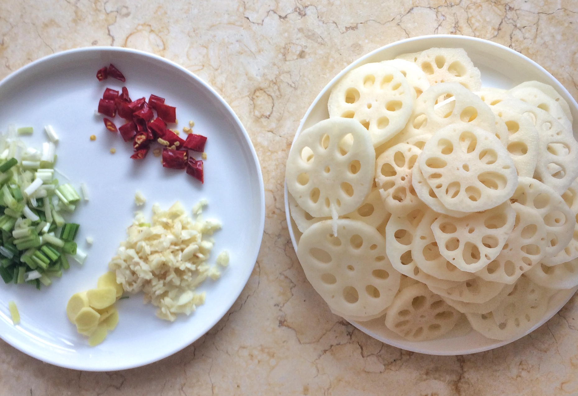 Prep ginger, garlic, green onion, chili peppers; slice lotus root thinly.