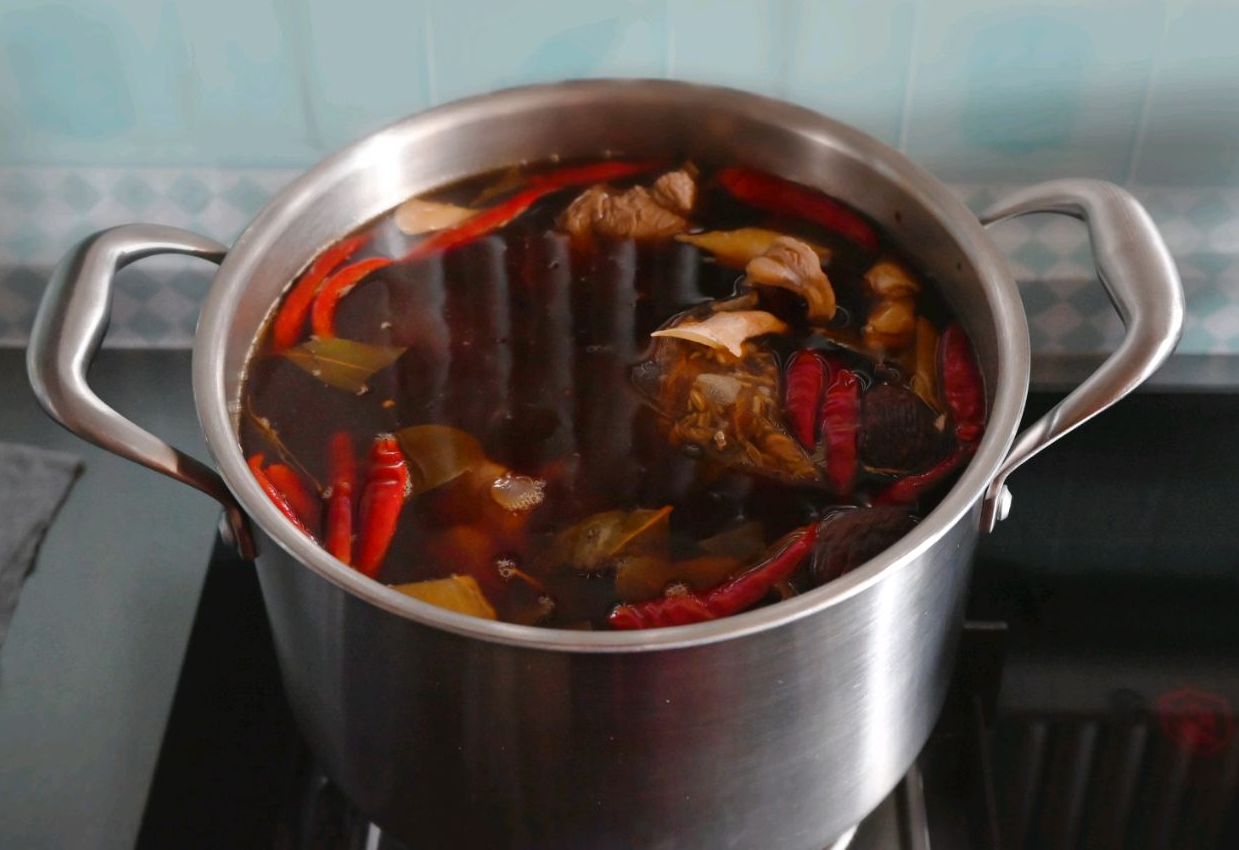 Simmer blanched beef shank covered for 2 hours; adjust cooking time for preferred tenderness.