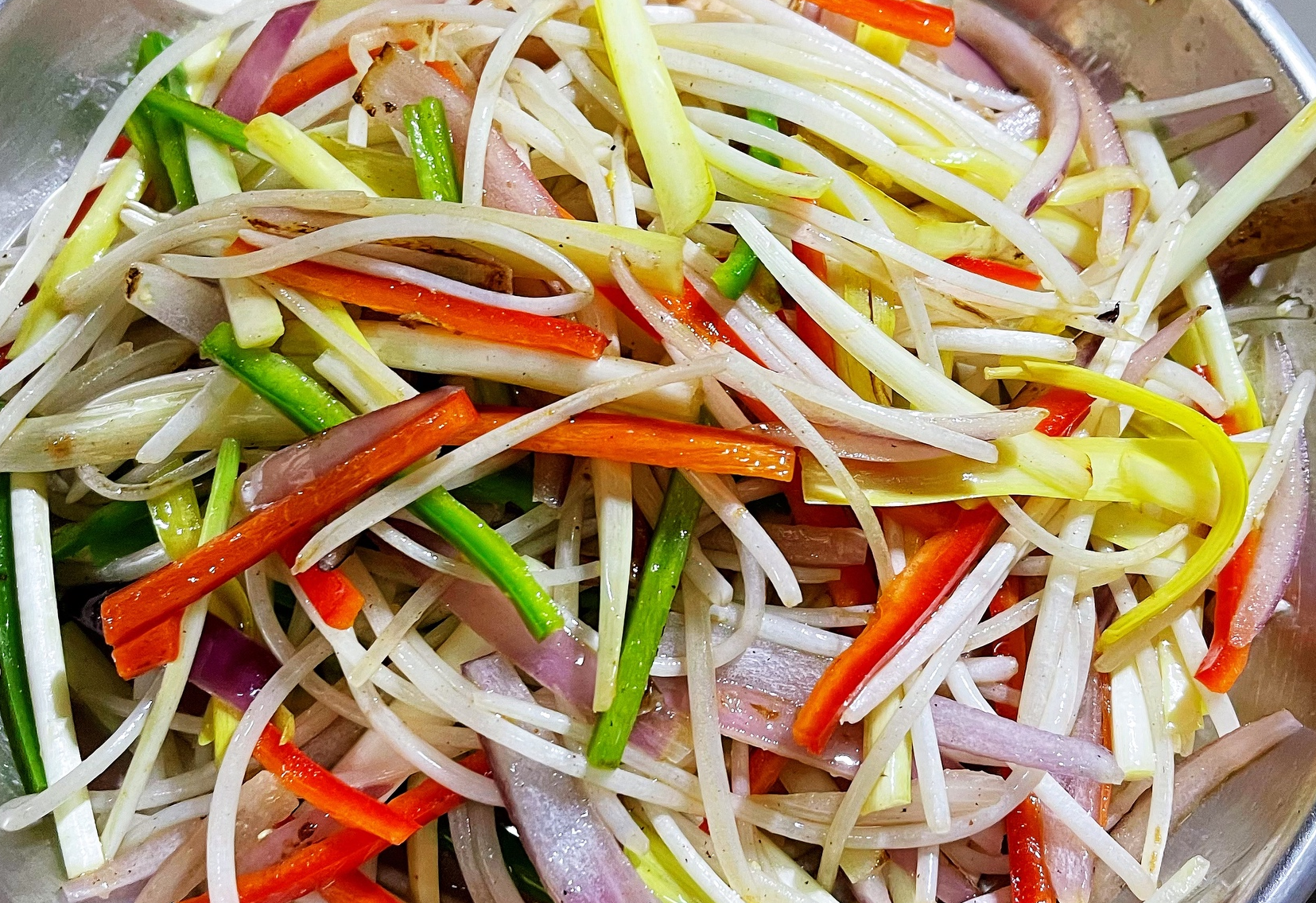 Quickly stir-fry vegetables in hot oil with salt for best results.