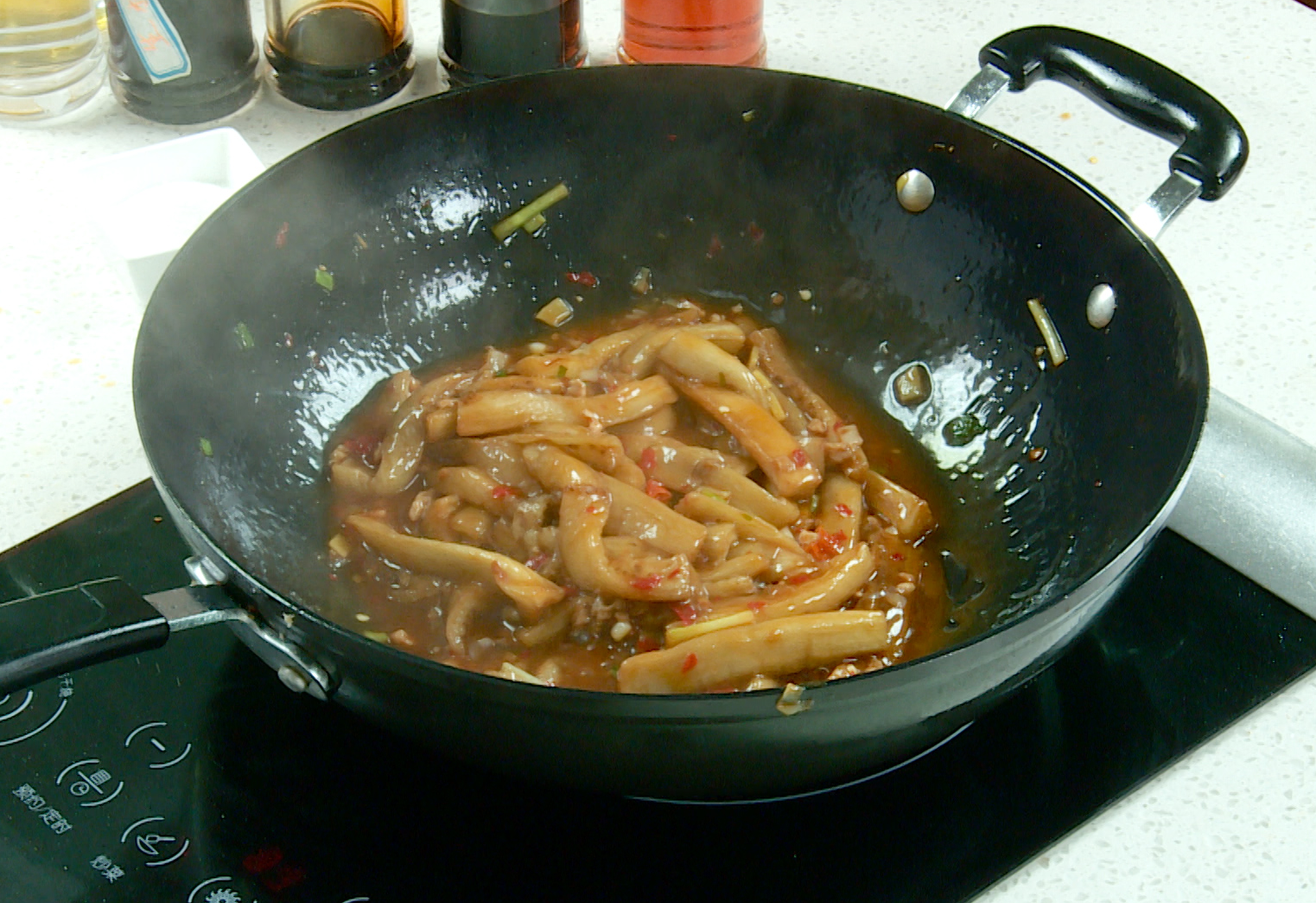 Thicken sauce by adding cornstarch water and stirring until thickened.