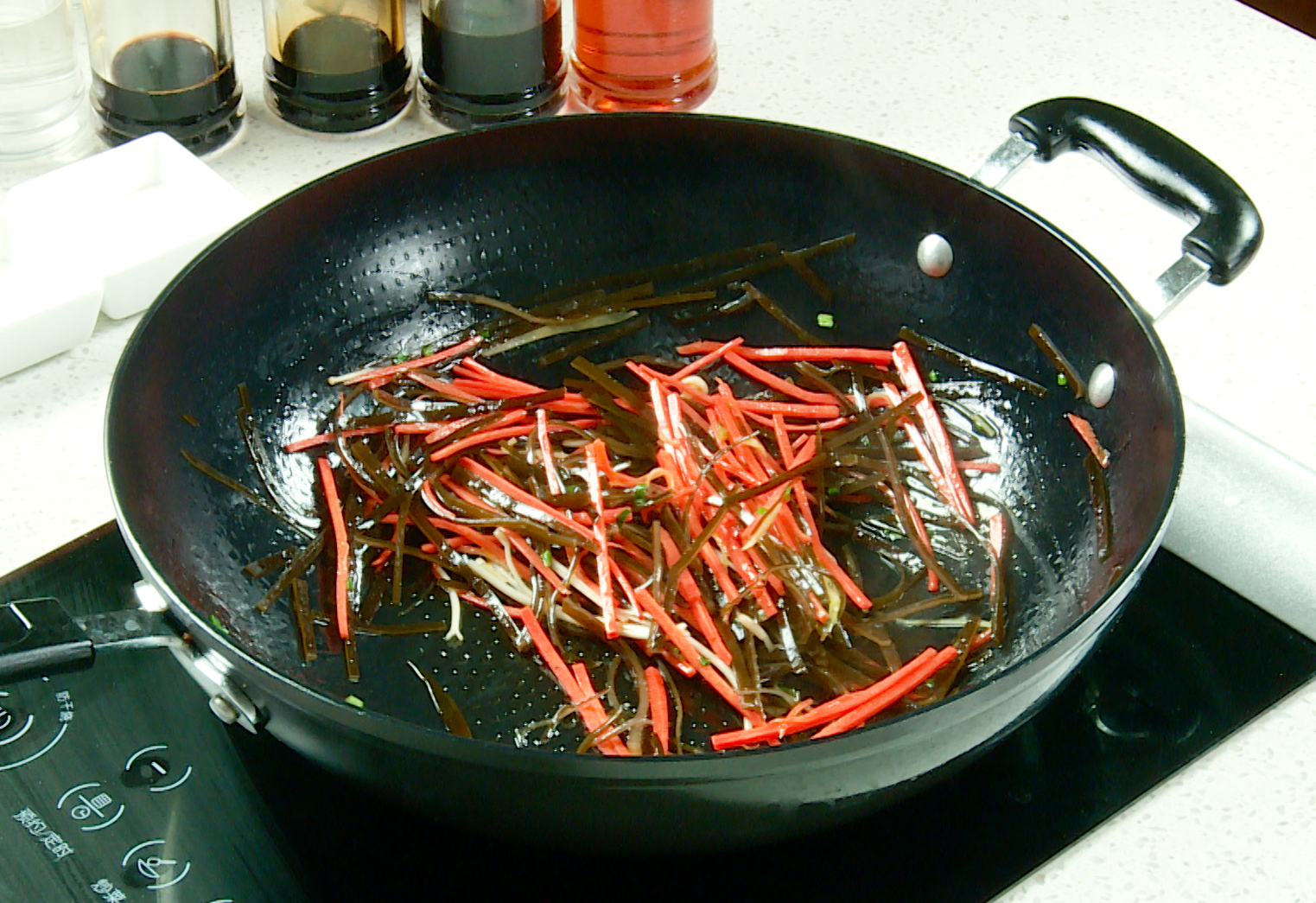 Recipe for delicious stir-fry with ginger, green onion, carrot, and kelp.