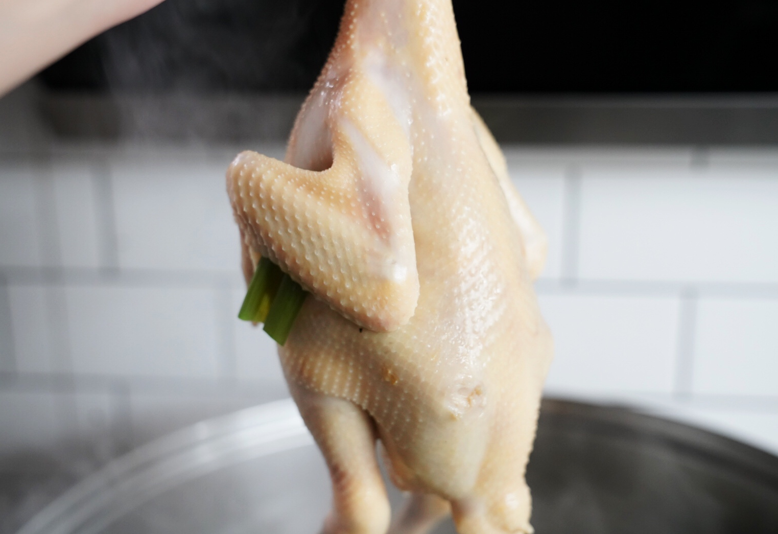 Boil chicken briefly before removing from pot for cooking.